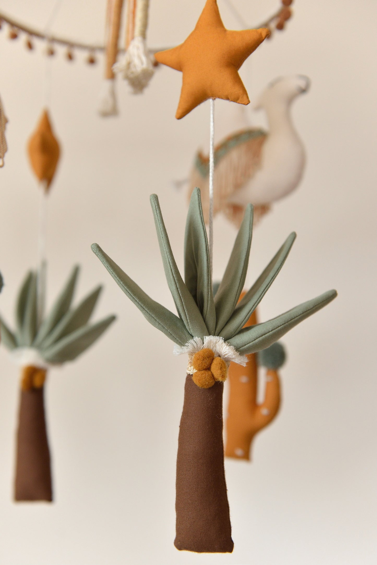 Desert Rainbow Nursery Mobile in Ochre