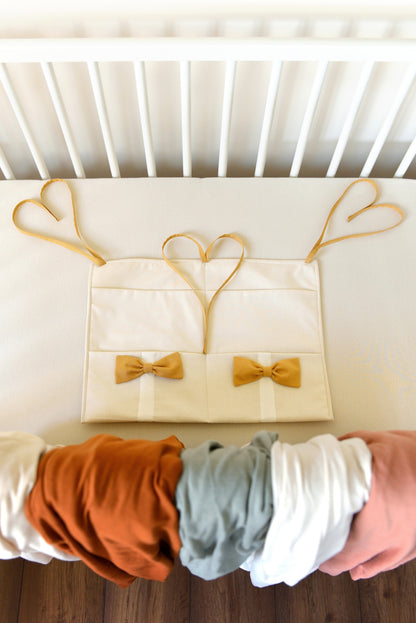 Ivory Hanging Crib Organizer With Decorative Bows