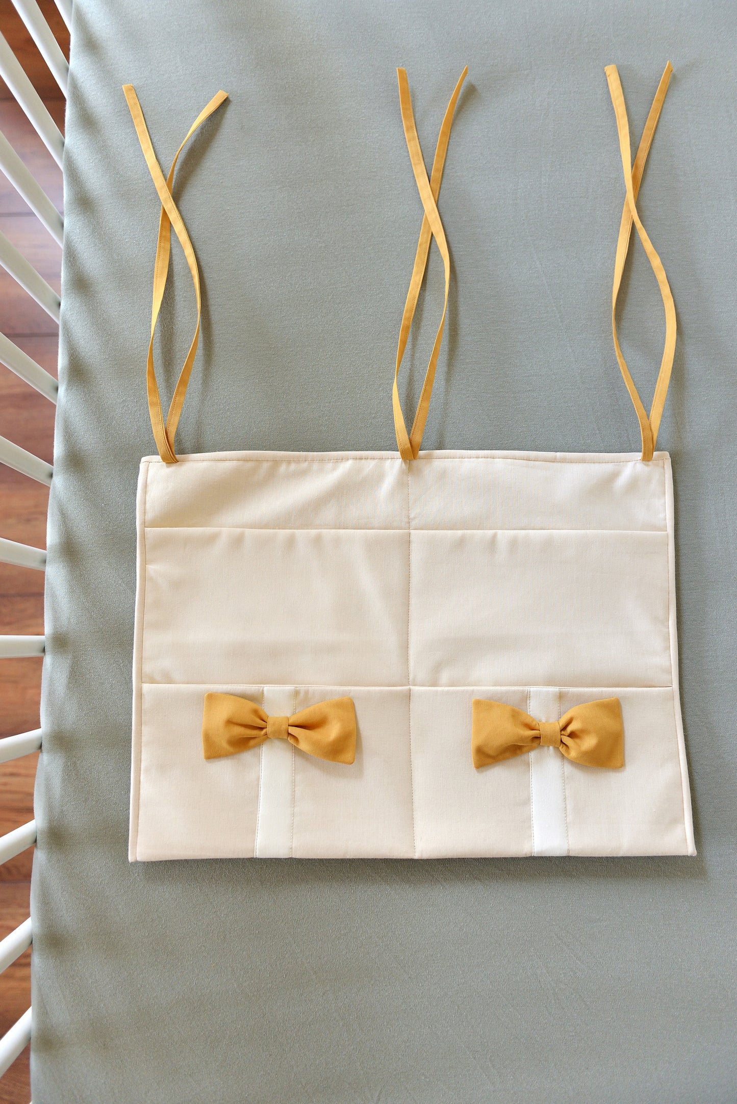Ivory Hanging Crib Organizer With Decorative Bows