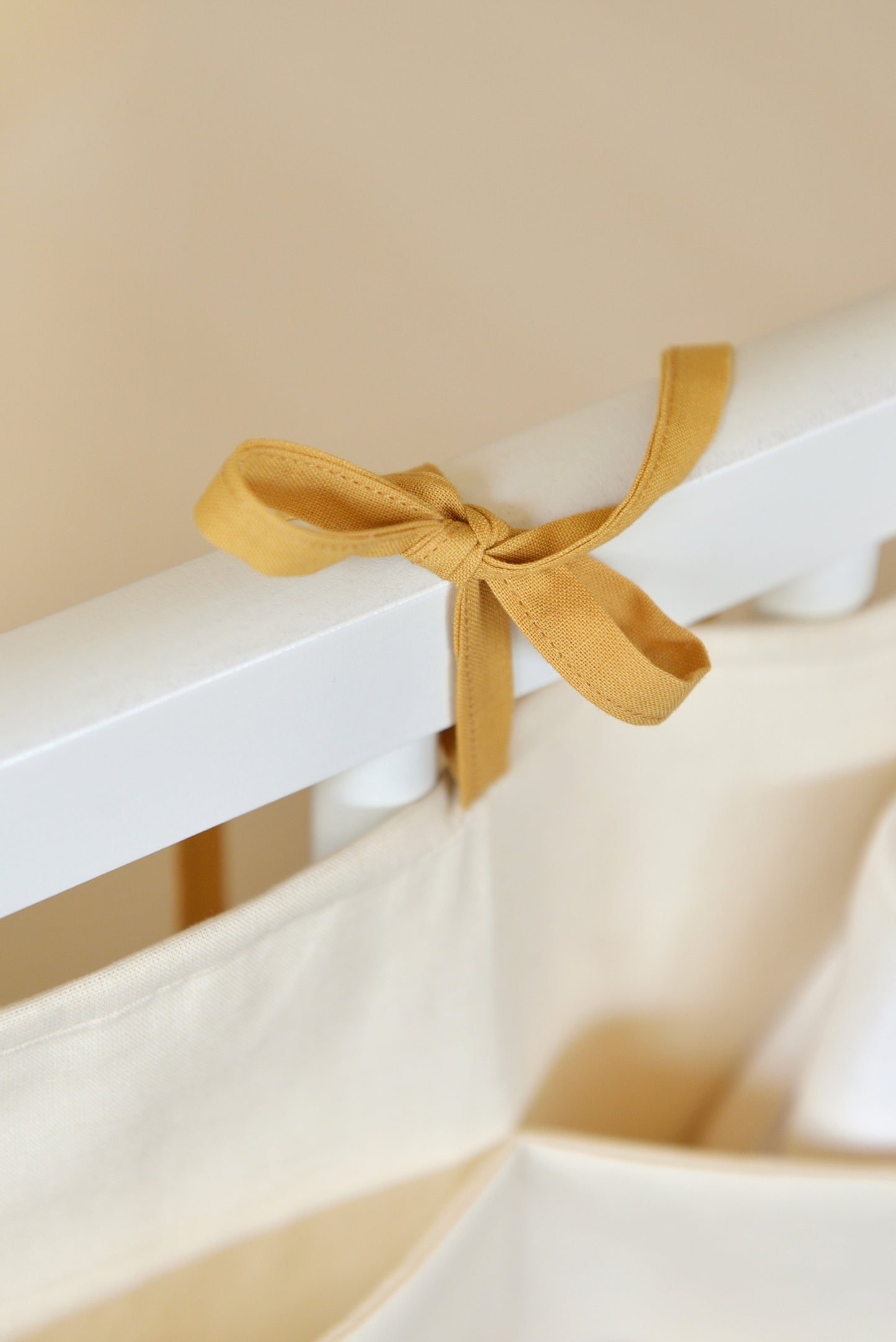 Ivory Hanging Crib Organizer With Decorative Bows