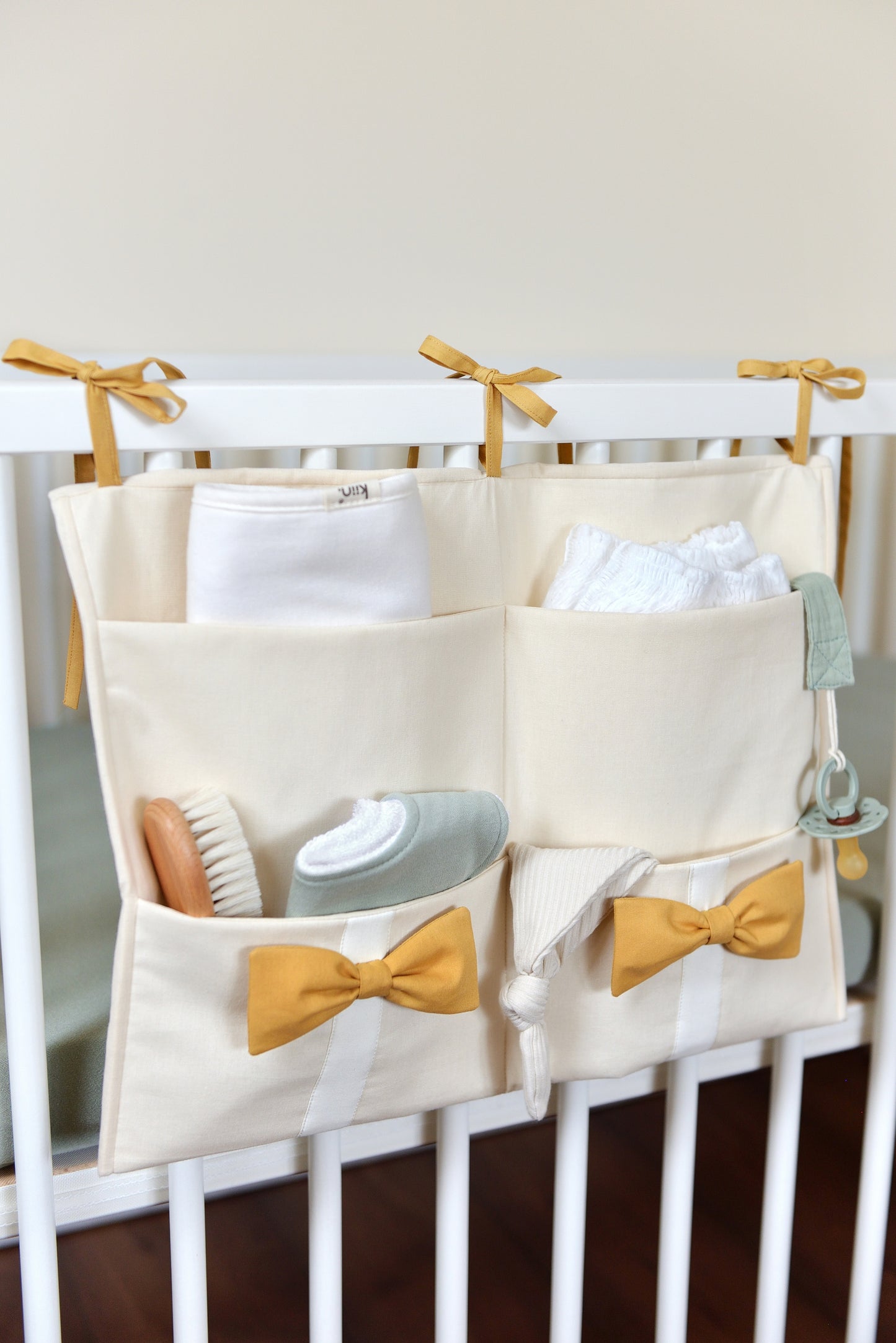 Ivory Hanging Crib Organizer With Decorative Bows